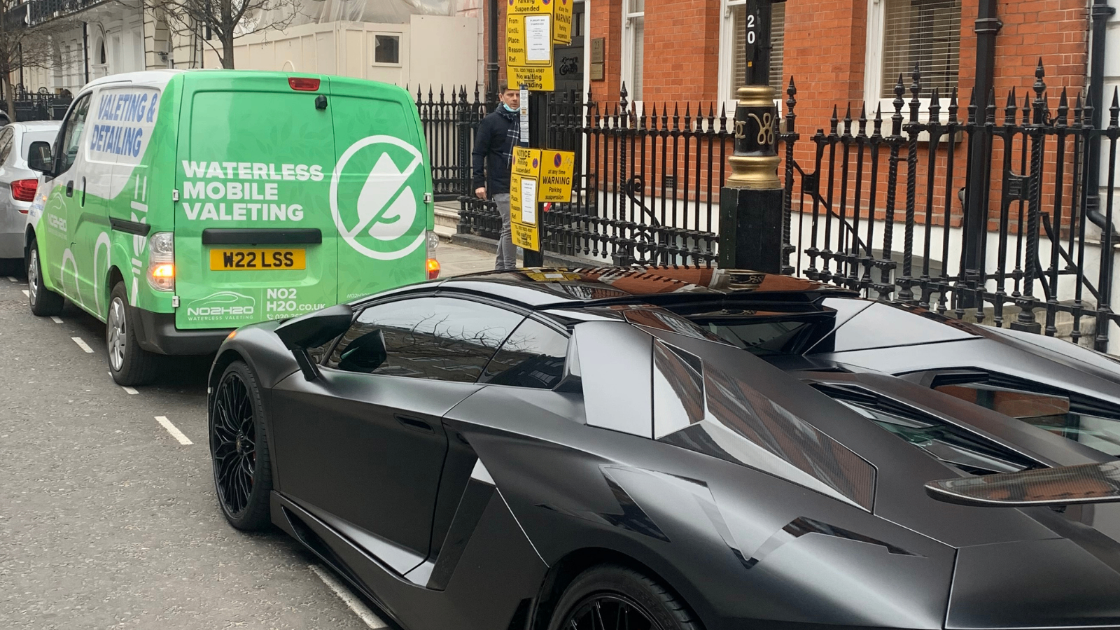 Matte black Lamborghini Aventador valeted next to the NO2H2O van in Mayfair