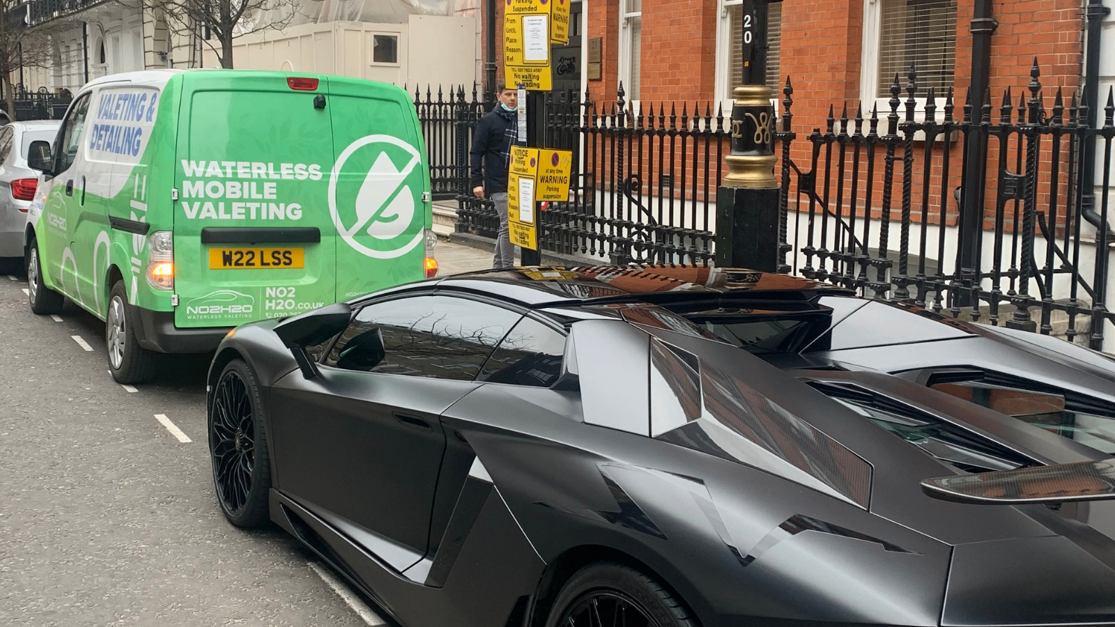 Car detailed beside the NO2H2O electric van on a West London residential street