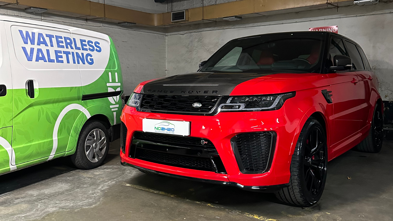 NO2H2O detailer finishing paintwork by hand on a Chiswick permit street